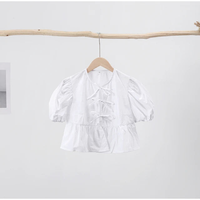 Kirsten - Damesblouse met pof mouwen en strikjes in verschillende prints